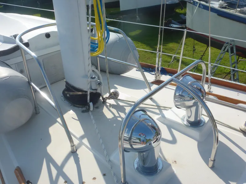 Slide: The Image of Deck of 1990 Sabre 425 sailboat with chrome fittings and rigging. - 18