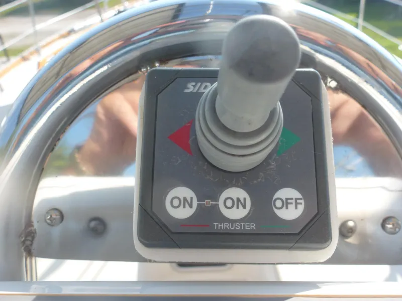Slide: The Image of Control panel of a 1990 Sabre 425 boat with thruster joystick. - 22
