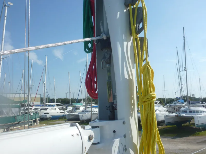 Slide: The Image of Close-up of Sabre 425 sailboat mast with colorful ropes, docked in a marina, 1990 model. - 27