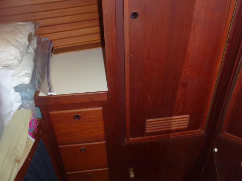 Slide: The Image of Wooden interior storage cabinet with drawers in a 1990 Sabre 425 sailboat. - 31