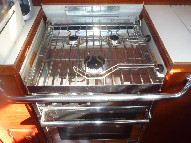 Slide: The Image of 1990 Sabre 425 yacht kitchen stove and oven. - 49