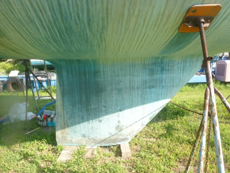 Slide: The Image of Bottom view of a 1990 Sabre 425 sailboat on a grassy yard. - 5