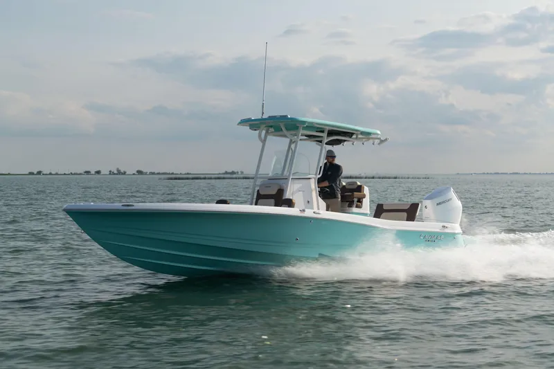 The Image of 2024 Caymas 28 Hybrid boat cruising on open water. - 1