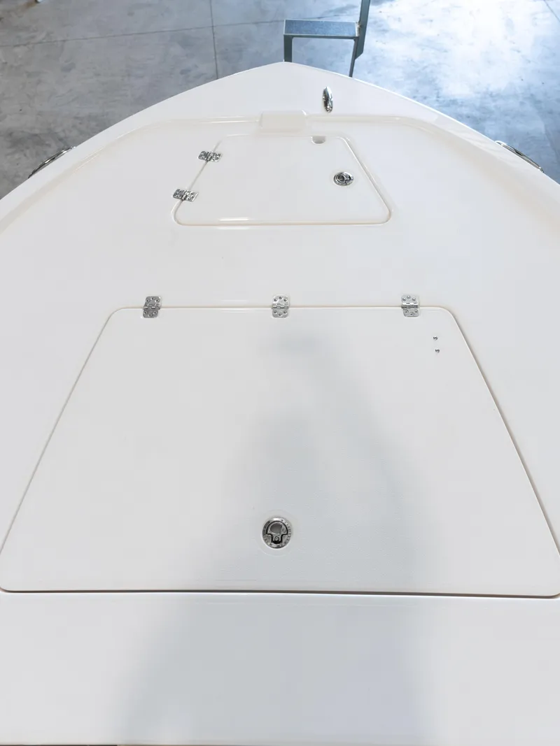 Slide: The Image of 2024 Caymas 28 Hybrid boat deck with storage compartments. - 17