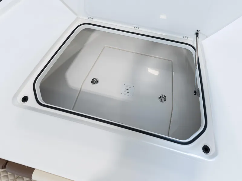 Slide: The Image of 2024 Caymas 28 Hybrid storage compartment with open lid. - 18
