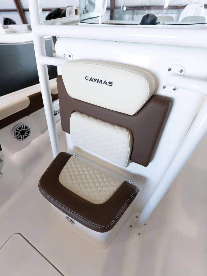 Slide: The Image of 2024 Caymas 28 Hybrid boat seat with brown and white cushioned design. - 25