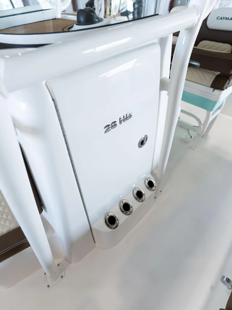 Slide: The Image of 2024 Caymas 28 Hybrid boat interior detail with rod holders. - 28