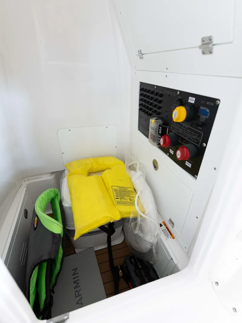 Slide: The Image of 2024 Caymas 28 Hybrid boat interior storage with safety equipment. - 29