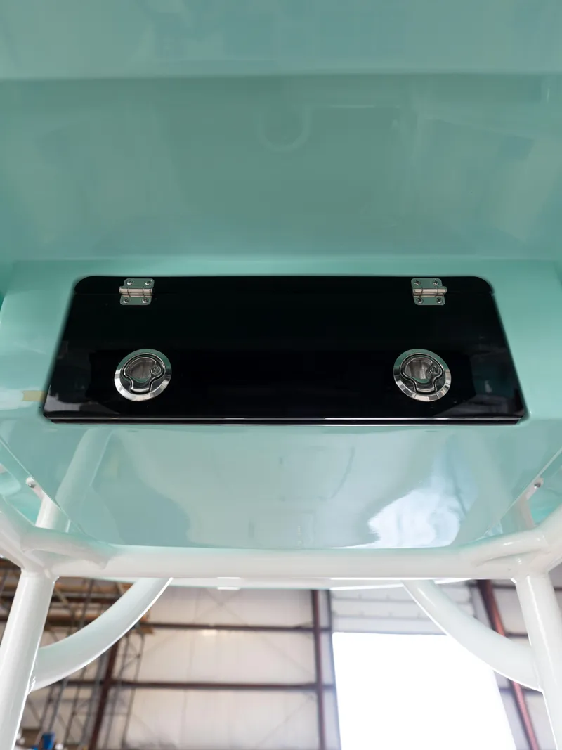 Slide: The Image of 2024 Caymas 28 Hybrid boat interior detail with storage compartment. - 33