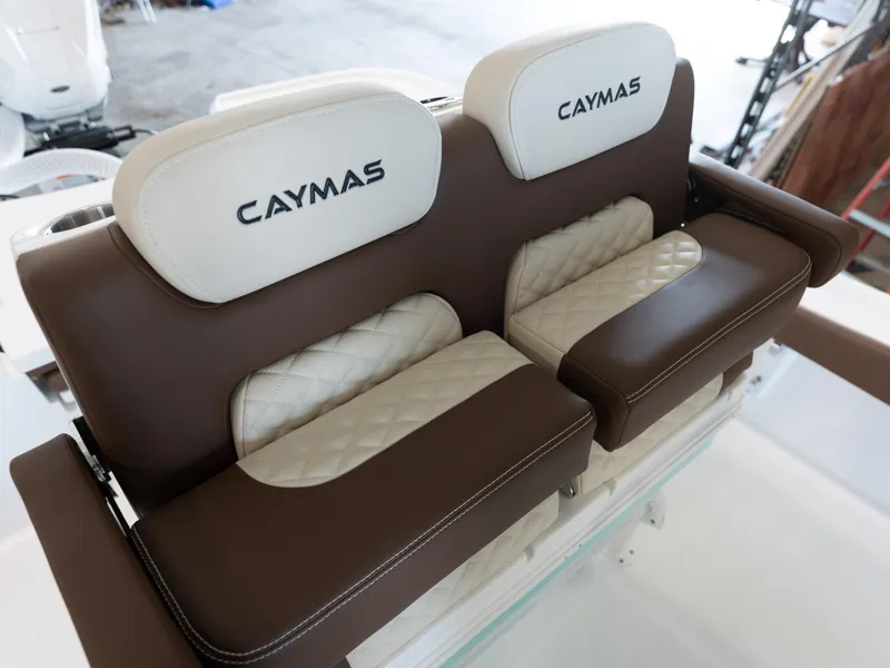Slide: The Image of 2024 Caymas 28 Hybrid boat seats with brown and white upholstery. - 40
