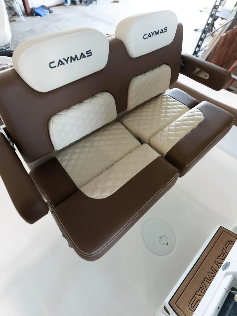 Slide: The Image of 2024 Caymas 28 Hybrid boat with luxurious brown and beige seating. - 41