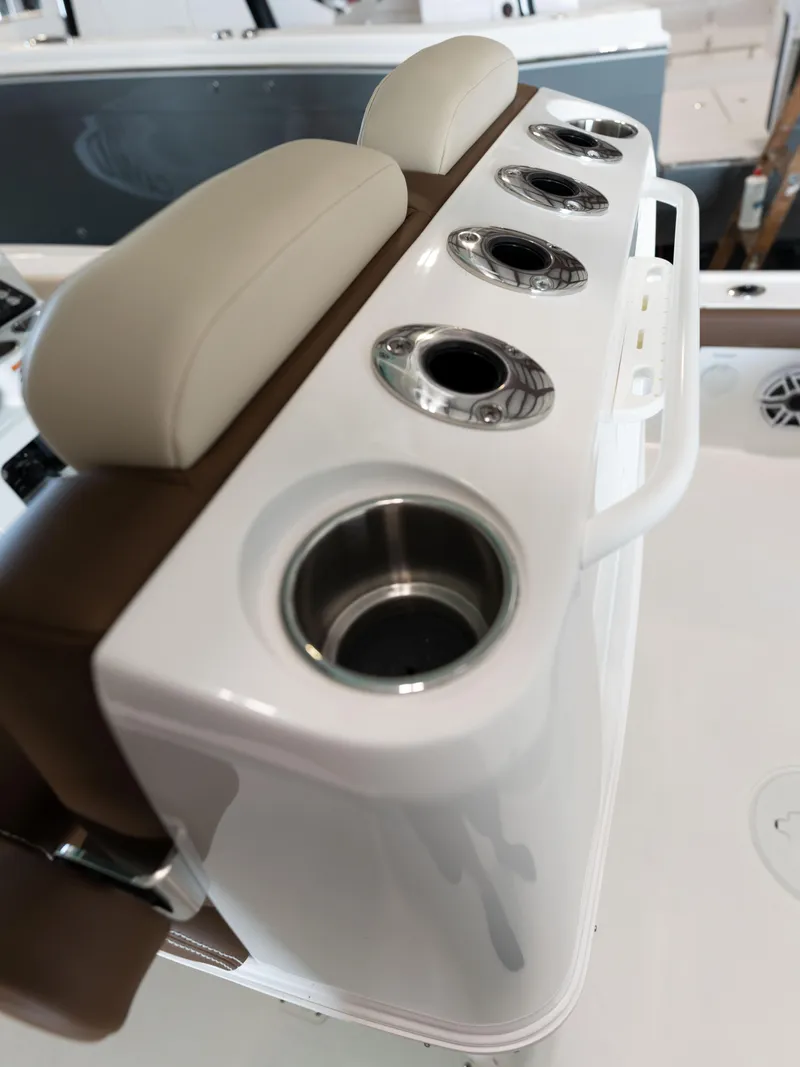Slide: The Image of 2024 Caymas 28 Hybrid boat with cup holders and cushioned seating. - 43