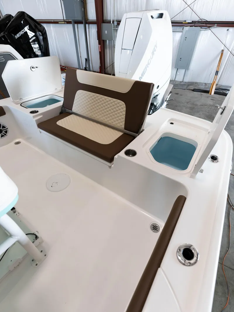 Slide: The Image of 2024 Caymas 28 Hybrid boat interior with seating and storage compartments. - 44