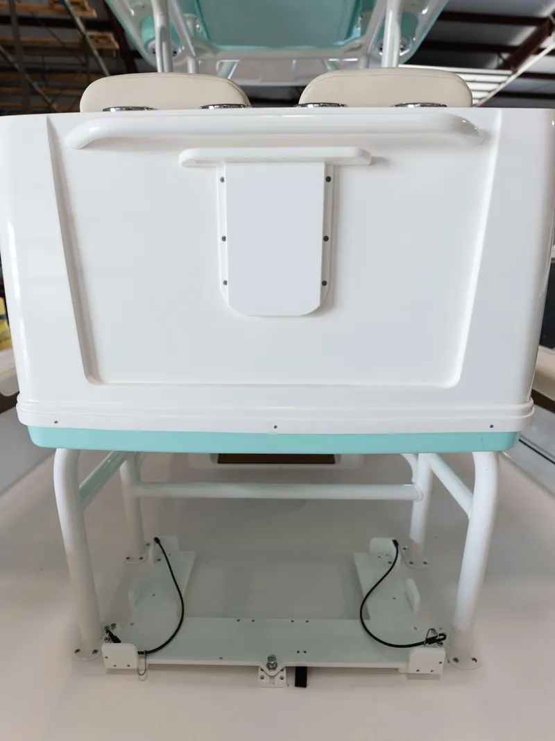 Slide: The Image of 2024 Caymas 28 Hybrid boat interior, featuring a white and teal design. - 49