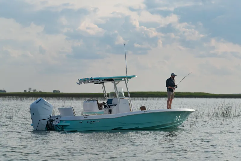 Slide: The Image of 2024 Caymas 28 Hybrid boat with fisherman on calm water. - 6