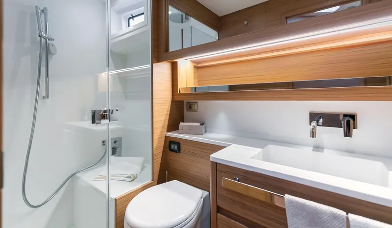 Slide: The Image of Luxurious bathroom in 2025 Solaris 52 Coupe yacht with modern fixtures and wooden accents. - 8