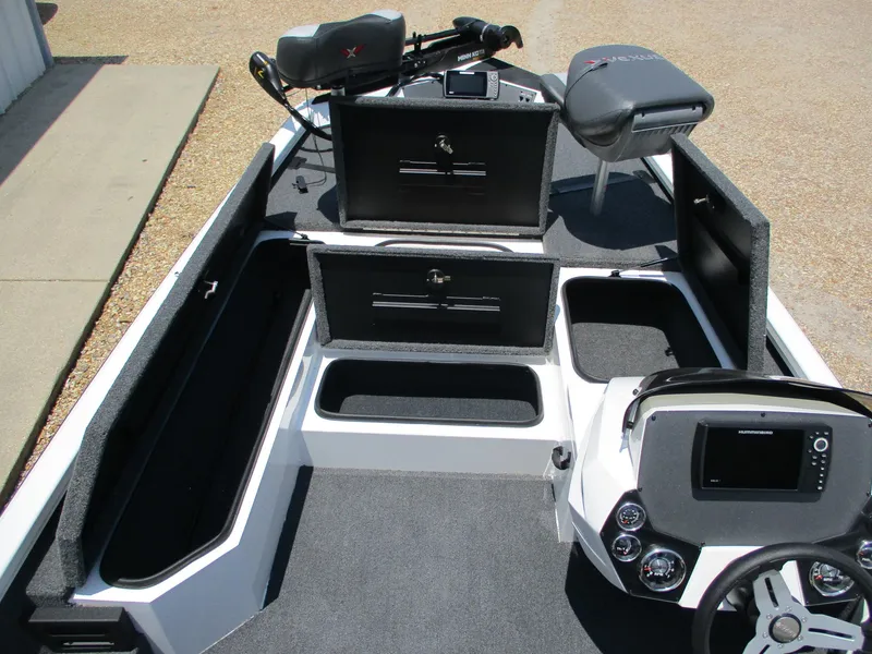 Slide: The Image of 2023 Vexus AVX181 boat interior with storage compartments and control console. - 10
