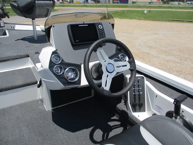 Slide: The Image of 2023 Vexus AVX181 boat dashboard with steering wheel and control panel. - 15