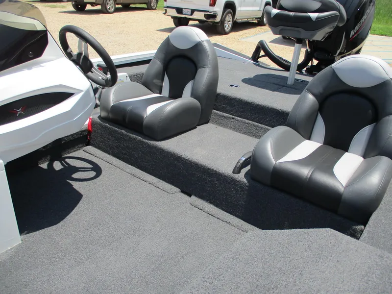 Slide: The Image of 2023 Vexus AVX181 boat interior with dual black and white seats. - 17