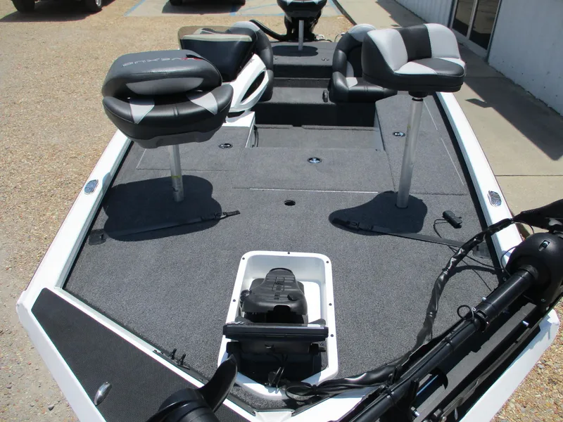 Slide: The Image of 2023 Vexus AVX181 fishing boat interior with seating and storage compartments. - 2