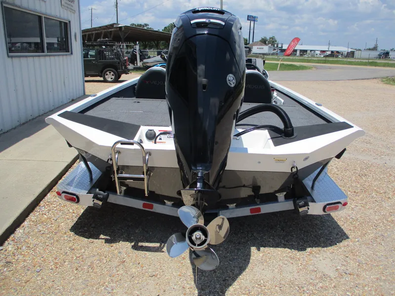 Slide: The Image of 2023 Vexus AVX181 boat rear view with outboard motor and trailer. - 4