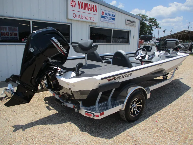 Slide: The Image of 2023 Vexus AVX181 boat with Mercury outboard motor at dealership. - 6