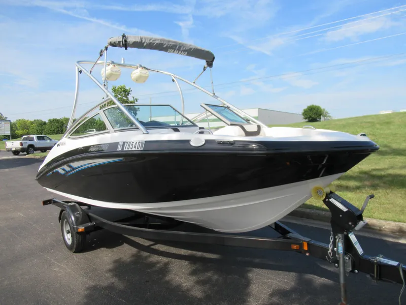 Slide: The Image of 2013 Yamaha Boats AR190 on trailer, black and white, parked outdoors. - 7