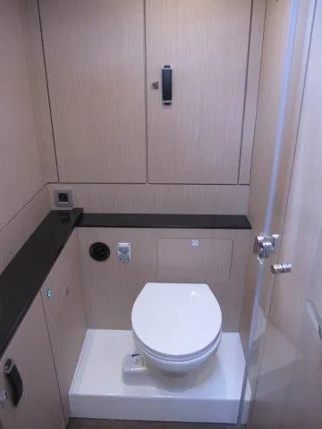 Slide: The Image of Modern bathroom in 2024 Jeanneau 55 yacht with sleek design and compact toilet. - 21