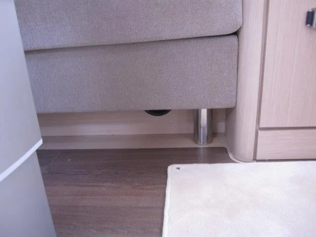 Slide: The Image of Interior of 2024 Jeanneau 55 yacht, featuring modern furniture and flooring. - 40