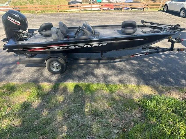 Slide: The Image of 2024 Tracker Pro Team 190 TX boat on trailer, parked outdoors. - 5