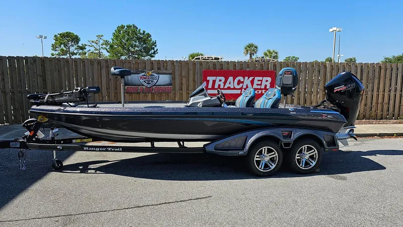Slide: The Image of 2024 Ranger Z520R Ranger Cup Equipped boat on trailer, displayed outdoors. - 0