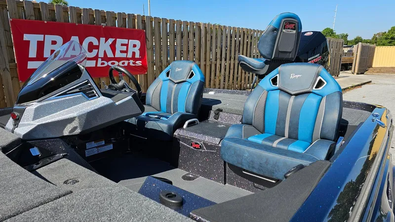 Slide: The Image of 2024 Ranger Z520R Ranger Cup Equipped boat with blue seats, displayed at Tracker Boats. - 4