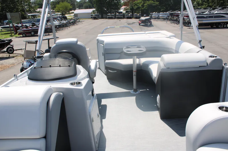 Slide: The Image of 2023 Lowe SS190 Super Sport pontoon boat interior with seating and table. - 4