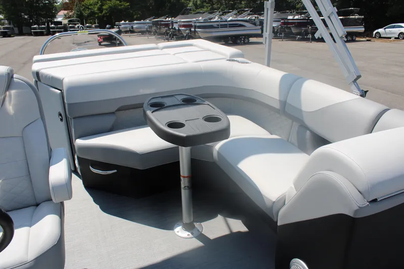 Slide: The Image of 2023 Lowe SS190 Super Sport boat interior with cushioned seating and cup holders. - 6