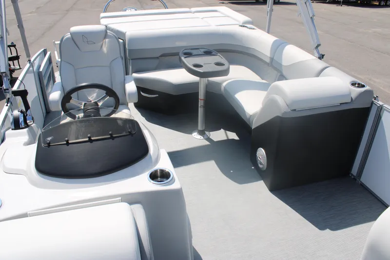 Slide: The Image of 2023 Lowe SS190 Super Sport boat interior with seating and steering console. - 7