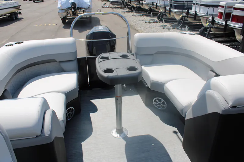Slide: The Image of 2023 Lowe SS230 Super Sport pontoon boat interior with seating and table. - 6