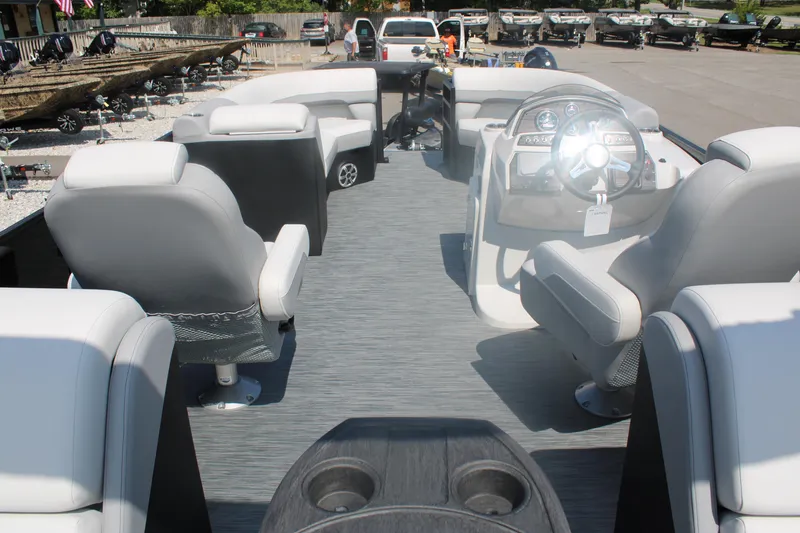 Slide: The Image of 2023 Lowe SS230 Super Sport pontoon boat interior with seating and steering console. - 7