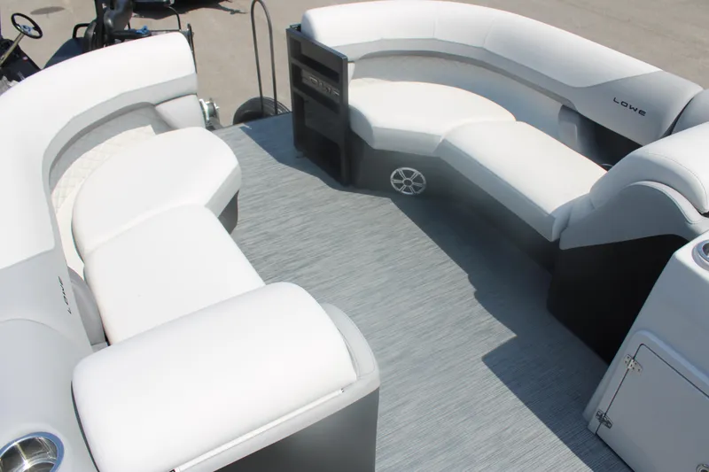 Slide: The Image of 2023 Lowe SS230 Super Sport boat interior with white cushioned seating. - 8
