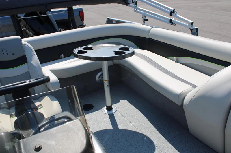 Slide: The Image of 2023 Lowe SD224 Sport Deck boat interior with seating and table. - 6