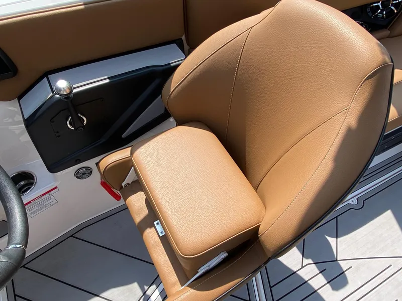 Slide: The Image of 2023 Moomba Craz boat captain's seat with tan upholstery and modern design. - 11