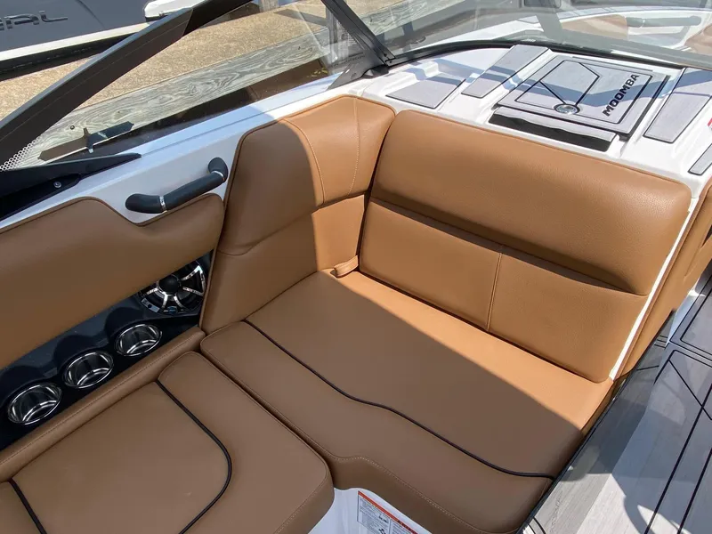 Slide: The Image of 2023 Moomba Craz boat interior with tan leather seating and modern design. - 13