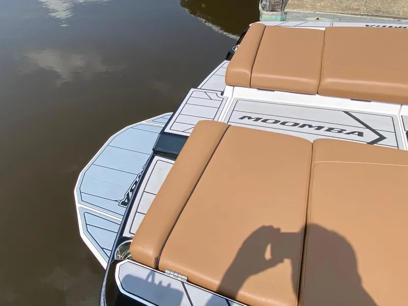 Slide: The Image of 2023 Moomba Craz boat with tan seating on the water. - 18