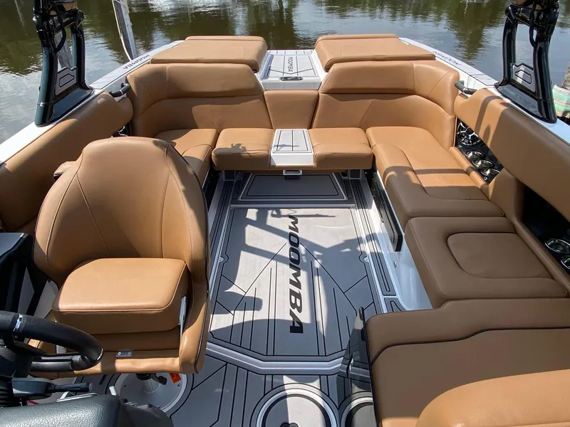Slide: The Image of 2023 Moomba Craz boat interior with tan leather seating and modern design. - 9
