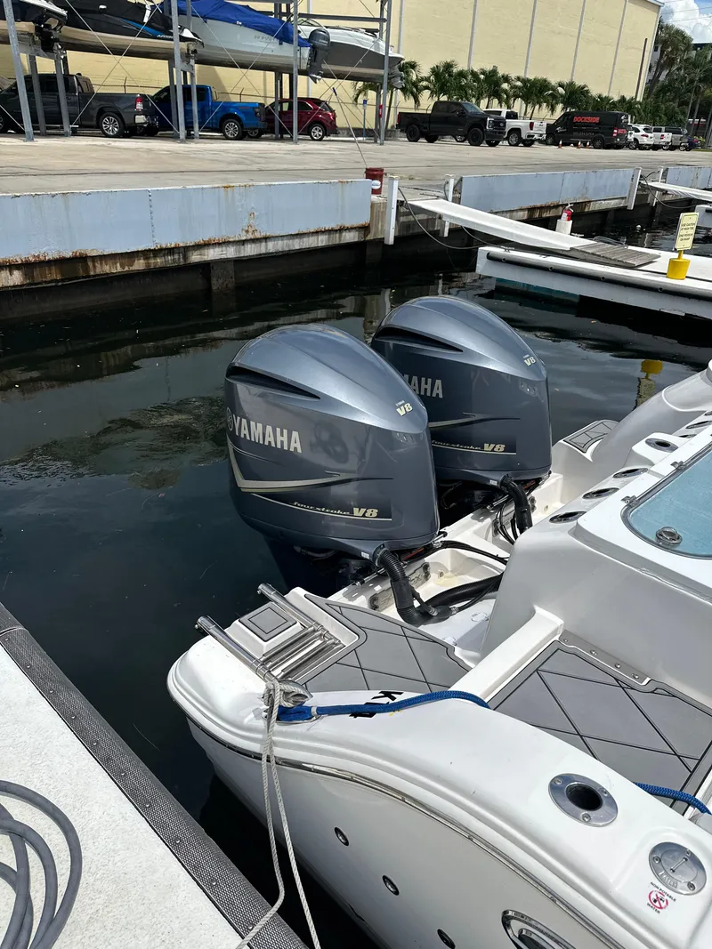 Slide: The Image of 2020 Sea Fox 328 Commander with twin Yamaha V8 outboard engines docked at marina. - 3