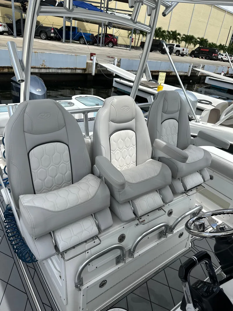 Slide: The Image of 2020 Sea Fox 328 Commander boat with three luxurious captain's chairs at the helm. - 5