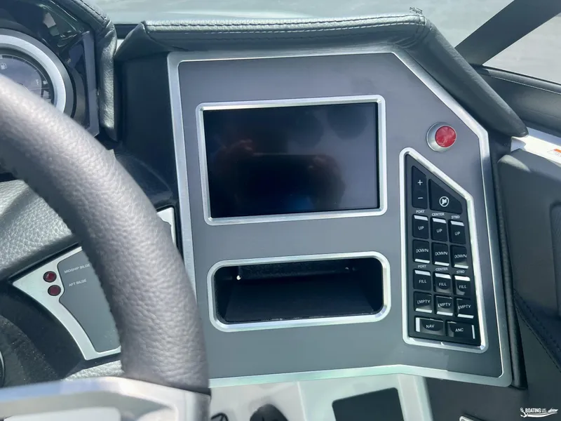 Slide: The Image of 2023 MasterCraft XT24 dashboard with touchscreen and control panel. - 6