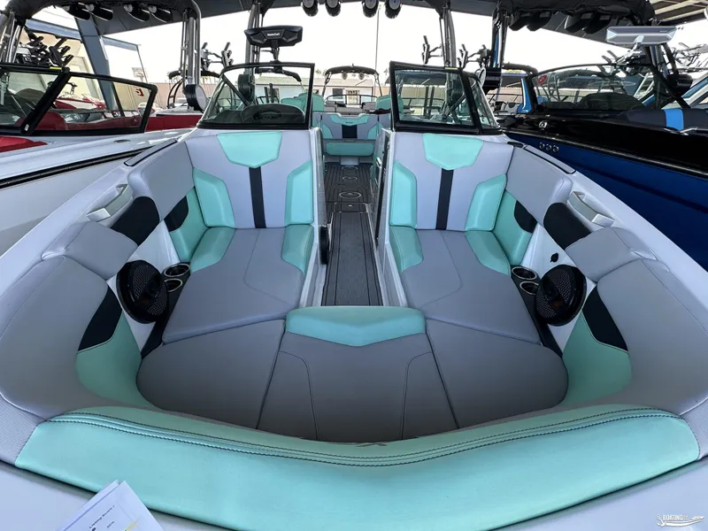 Slide: The Image of 2023 MasterCraft XT24 boat interior with mint and gray seating. - 8