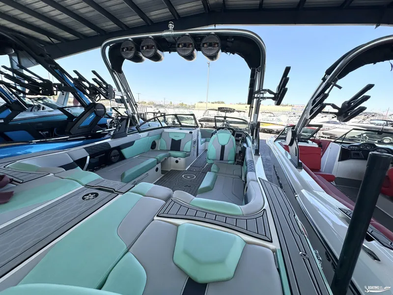 Slide: The Image of 2023 MasterCraft XT24 boat interior with modern seating and sleek design. - 9
