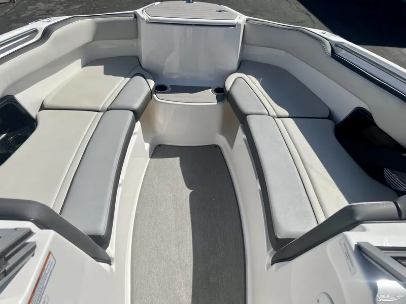 Slide: The Image of 2021 Yamaha AR250 boat interior with spacious seating and cup holders. - 4