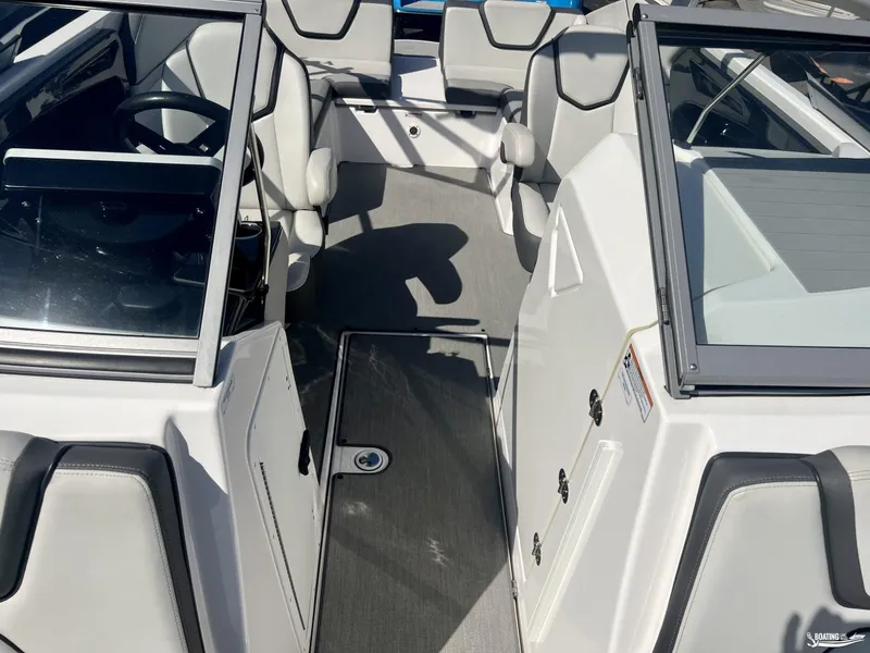 Slide: The Image of 2021 Yamaha Boats AR250 interior with sleek seating and modern design. - 5